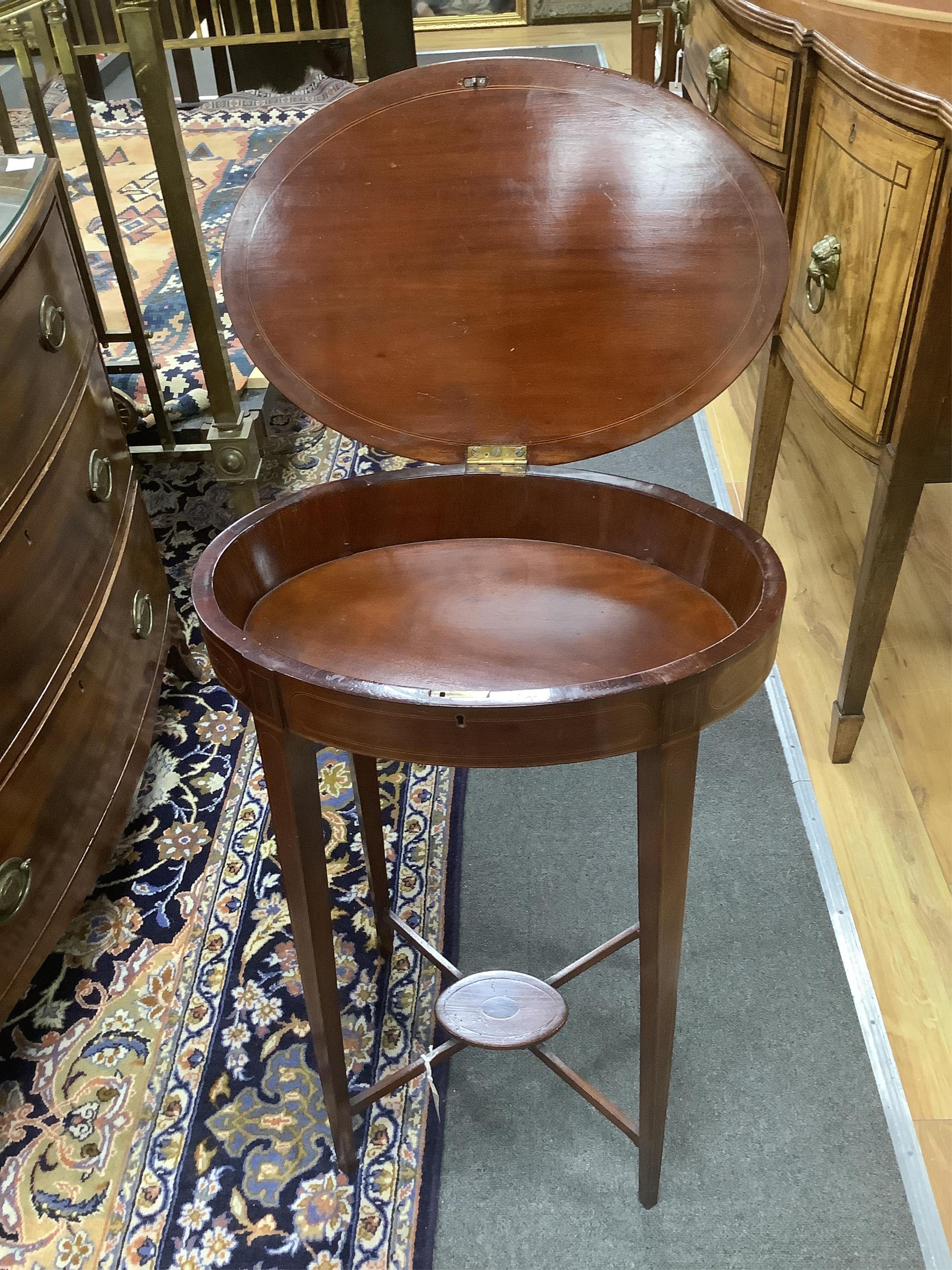 A Sheraton revival shell marquetry inlaid oval work table, width 50cm, depth 34cm, height 76cm. Condition - fair